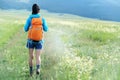 hiker walking on trail in grassland Royalty Free Stock Photo