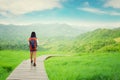 Hiker walking on wood path