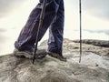 Hiker walks on Trail in warm trousers and waterproof boots Royalty Free Stock Photo