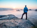 Hiker watch misty melancholic morning in cloudscape Royalty Free Stock Photo