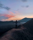 Hiker Watches Sunrise over Mount Bromo, Java, Indonesia