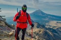 Hiker watches Volcano Popocatepetl erupt trekking in Iztaccihuatl Popocatepetl National Park, Mexico Royalty Free Stock Photo