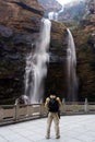 Hiker with Waterfall Royalty Free Stock Photo