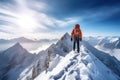 Hiker in winter mountains climbing on top of a mountain with snowshoes