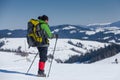 Hiker in winter mountains on sunny day Royalty Free Stock Photo