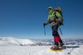 Hiker in winter mountains on sunny day Royalty Free Stock Photo