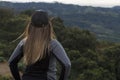 Hiker woman contemplating the green mountains of Costa Rica Royalty Free Stock Photo