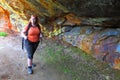 Hiker woman explore ancient underground mine.