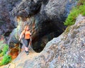 Hiker woman explore ancient underground mine. Royalty Free Stock Photo