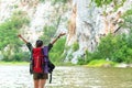 Hiker woman happy feeling freedom good and strong weight victorious facing on the natural mountain. Royalty Free Stock Photo