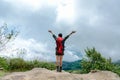 Hiker woman happy feeling freedom good and strong weight victorious facing on the natural mountain. Royalty Free Stock Photo