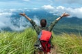 Hiker woman happy feeling freedom good and strong weight victorious facing on the natural mountain. Royalty Free Stock Photo