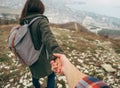 Hiker woman holding man's hand and leading him Royalty Free Stock Photo