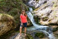 Foelzkogel - Hiker woman next to idyllic river Foelzbach, Hochschwab mountains, Styria, Austria. Hiking trail in alpine forest Royalty Free Stock Photo