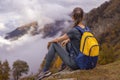 Hiker Woman rest in hike looking around autumn highland