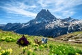 Hiker woman resting and looking the Pic du Midi Ossau in the french Pyrenees mountains Royalty Free Stock Photo