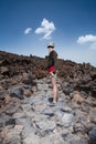 Hiker woman in volcanic landscape Royalty Free Stock Photo