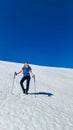 Dreilaendereck - Hiker woman walking on snow covered meadow at idyllic Dreilaendereck, Karawanks, Carinthia