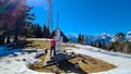 Dreilaendereck - Hiker woman at wooden monument at Dreilaendereck, Karawanks, Carinthia, Austria