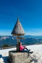 Dreilaendereck - Hiker woman at wooden monument at Dreilaendereck, Karawanks, Carinthia, Austria