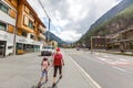 Zermatt, Switzerland - August 11, 2019 Hikers with backpack looking at mountains, alpine view, mother with child