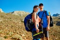 Hikers with backpacks and solar battery Royalty Free Stock Photo