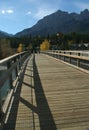Hikers on bridge over Bow River Royalty Free Stock Photo