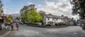 Hikers in the centre of Grasmere village in the Lake District, Cumbria, UK