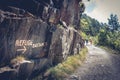 Hikers climb a mountain road towards the Bastanet refuge