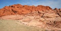Hikers and Climbers Dwarfed by Red Rock Canyon Royalty Free Stock Photo
