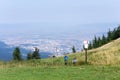 Hikers climbing mountains near Brasov town, Transylvania, Romania