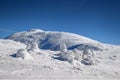 Hikers climbing to snowy Babia Gora summit Carpathians Poland