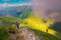 Hikers with colorful backpacks in Fagaras mountains, Carpathians,Transylvania, Romania Royalty Free Stock Photo