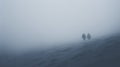 Hikers at distance during a strong blizzard