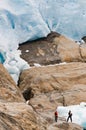 Hikers by glacier