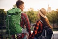 Hikers go sightseeing in tourist town on vacation