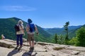 Hikers looking at the scenic view of Crawford Notch from Mt. Willard