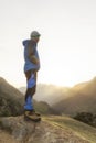 Hikers looking at the stunning landscape in the mountains during sunrise Royalty Free Stock Photo