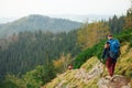 Hikers making their way down a rocky trail in the mountains Royalty Free Stock Photo