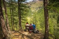 Hikers on the meadow in the mountain. Rabbi Valley, Trentino Alto Adige, Italy