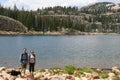 Hikers in the mountains rests at a lake Royalty Free Stock Photo