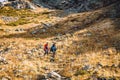 Hikers in the mountains. Tourists descend from the mountain Royalty Free Stock Photo