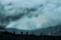 Hikers In Raw Climbing High Altitude Trial Above Low Clouds