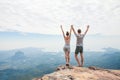 Hikers relaxing on top of a mountain