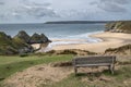 Hikers resting bench at Three Cliffs Bay Wales Royalty Free Stock Photo