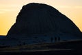 hikers silhouette against a large mountain at sunset Royalty Free Stock Photo