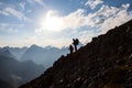 Hikers silhouette on a mountain slope