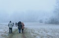 Hikers stroll in winter Royalty Free Stock Photo