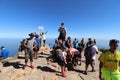 Hikers take a break and enjoy the panoramic views on top of Lions head mountain