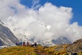 Hikers team on a hill in Himalayan mountains. Annapurna Base Camp track. Mountain Cloudy Landscape. Travel concept.